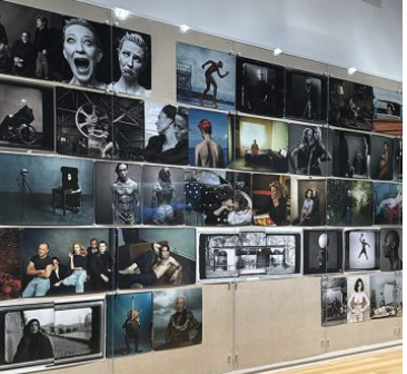 Wall of photographs picturing famous people.